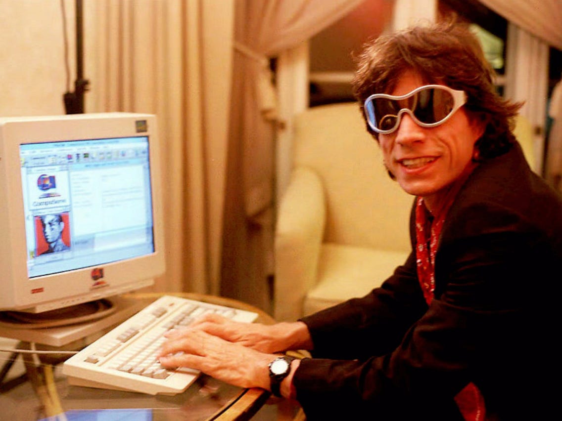 Mick Jagger uses a computer in the 1990s
